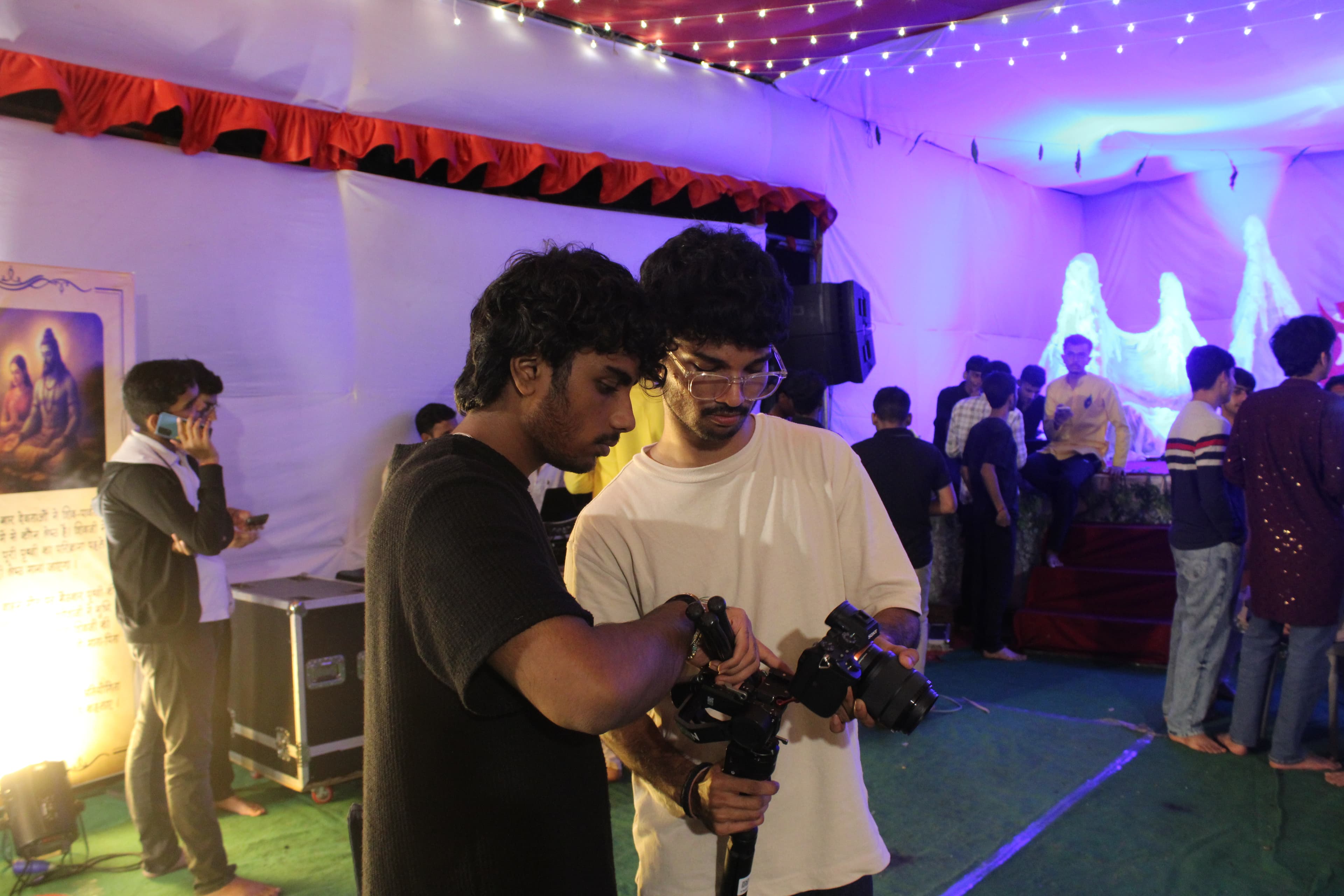 Rithwik and a friend filming at an event